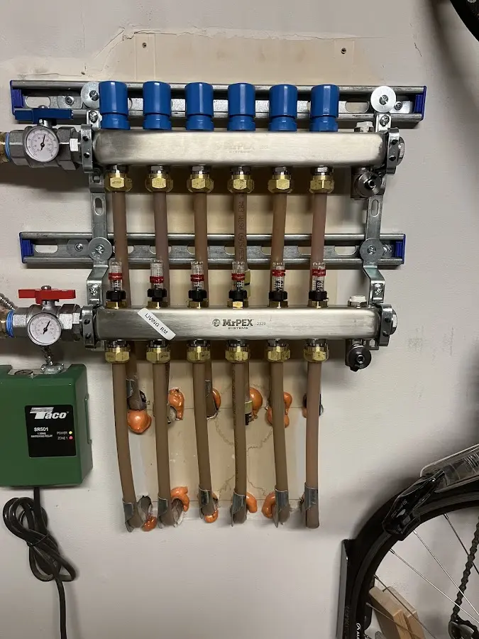 Plumber performing Water Heater Repair at a residential property in Alsace